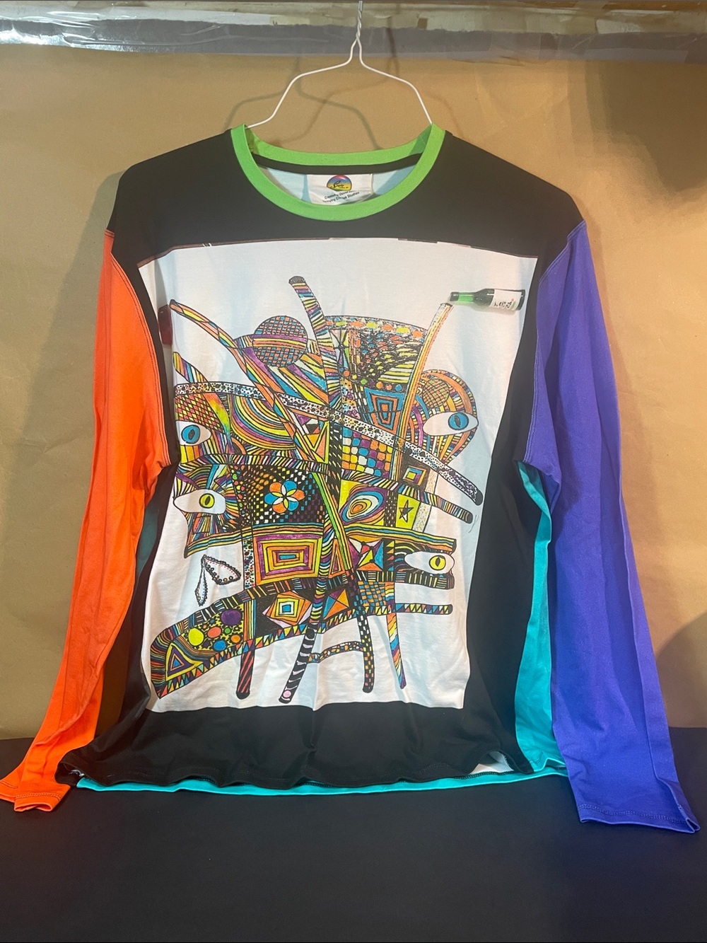 Vibrant Abstract Graphic Long Sleeve Top with Colorblock Sleeves